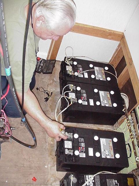 Photo of Dan installing batteries